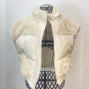 Oversized beige vest comes in one size